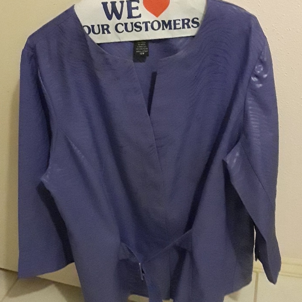 Lavender two piece suit. Skirt has split in the